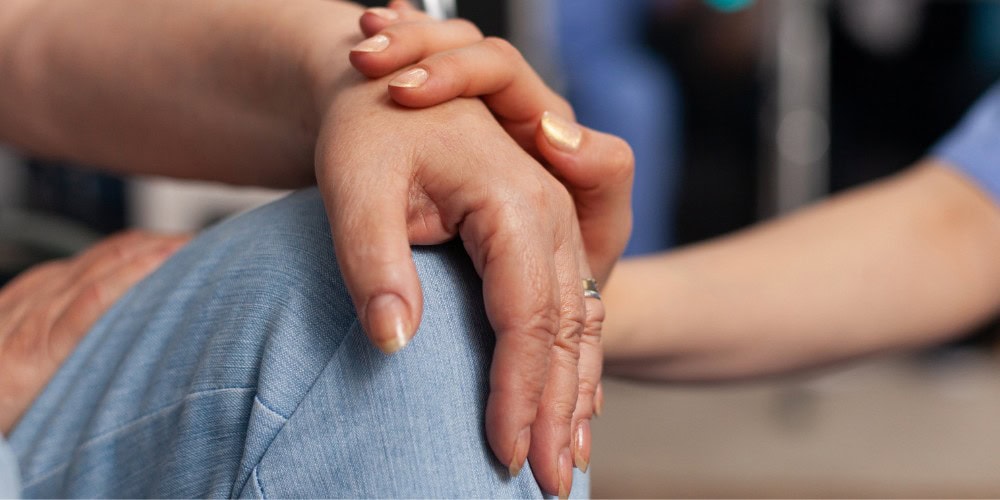 two people holding hands contact